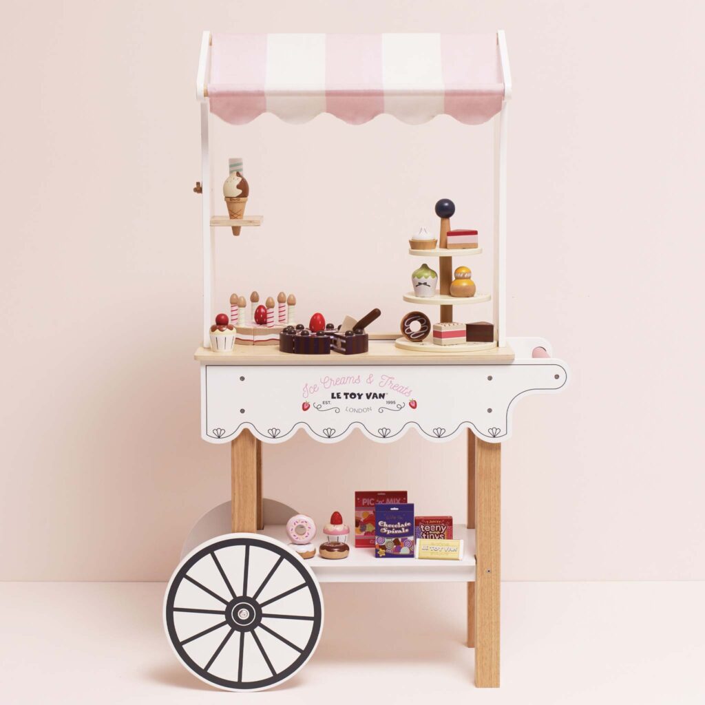 Junior Magazine It was love at first sight when we spotted this delightful pastel hued sweet trolley at Le Toy Van HQ. In a new cotton candy pink colour way for summer 2025 – we’re not sure who will have more fun styling this up with the additional ice-cream and candy play sets (sold individually).