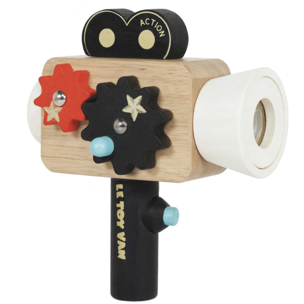 Junior Magazine Lights, camera, action! This wooden camera has spinning cogs and a kaleidoscopic lens for extra layers of discovery.