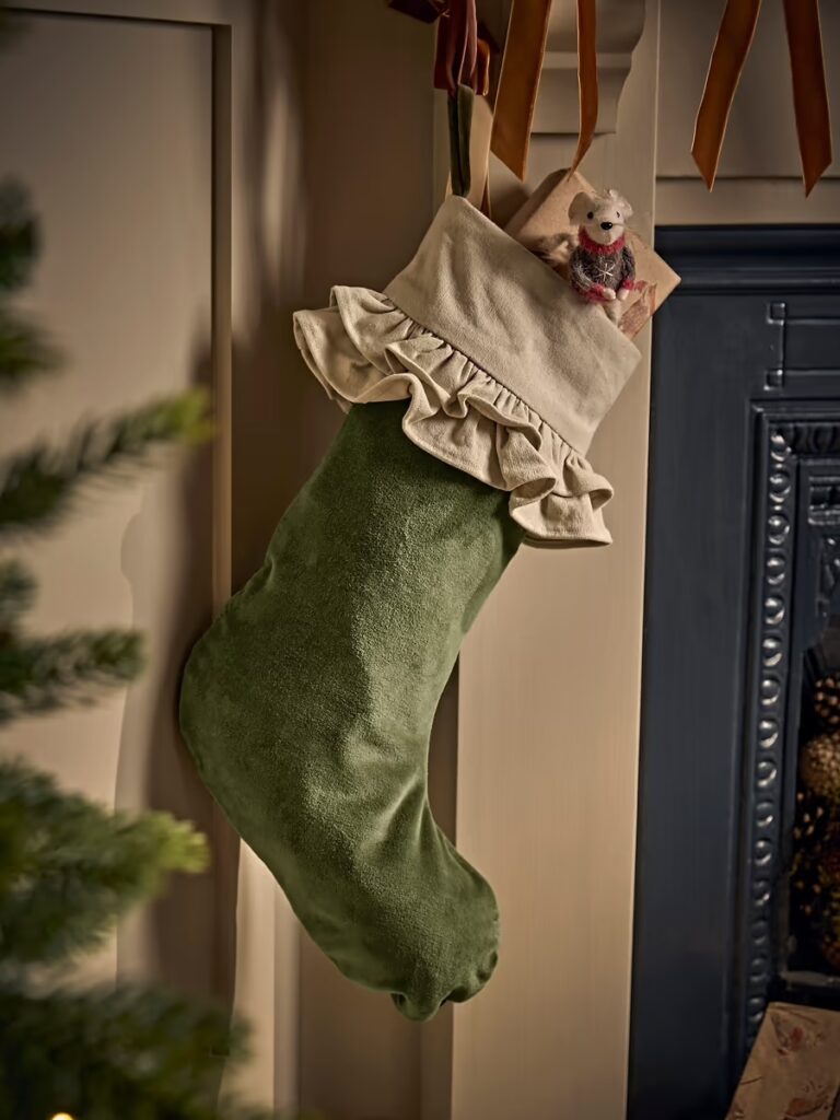 Junior Magazine Velvet Ruffle Stocking, £38, Cox & Cox