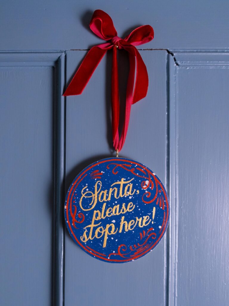 Junior Magazine Gabriella Moxey ‘Santa Stop Here’ Hand Painted Wooden Christmas Decoration, £55, Holly & Co