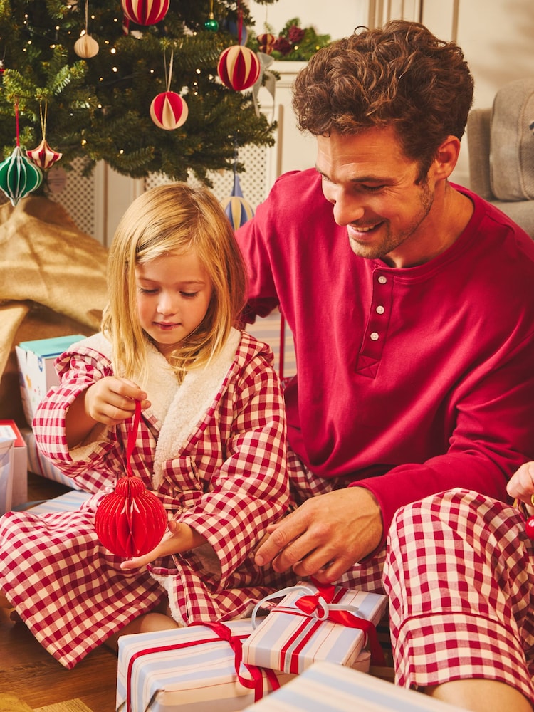 Junior Magazine Burgundy Gingham Men’s Pyjamas, £47 and Matching Children’s Dressing Gown, £27 both JoJo Maman Bébé