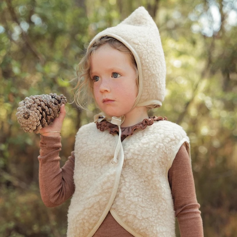 Junior Magazine Siskin Fleece Bonnet and Gilet,  £35, Mama Owl