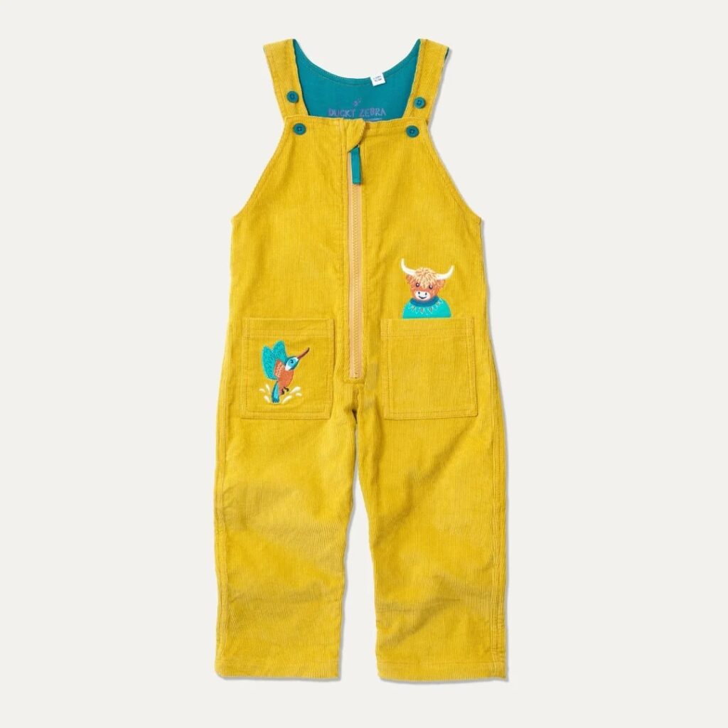 Junior Magazine Mustard Yellow Cord Dungarees in Highland Cow & Kingfisher, £35.50, Ducky Zebra